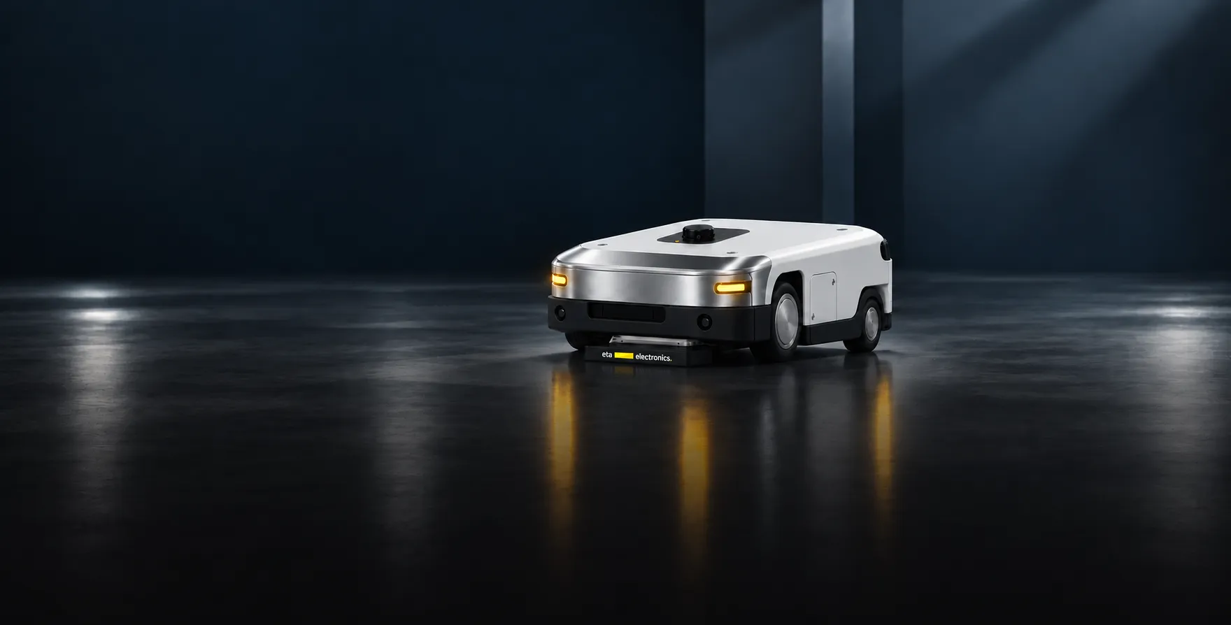 Autonomous mobile robot charging wirelessly in a dark industrial space